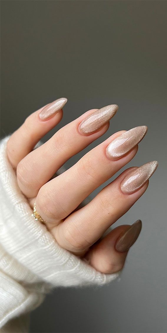 Almond nude nails with rose-gold chrome shimmer