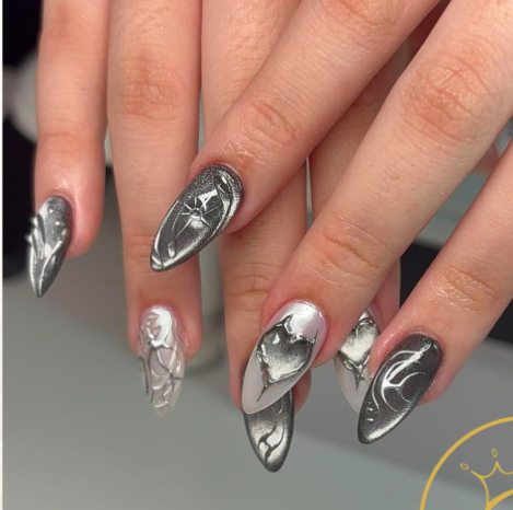 Almond nails with black and silver marble design and white accent nail