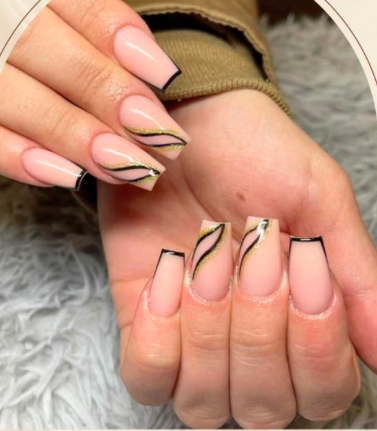 Square nude nails with black tips and gold wavy line design