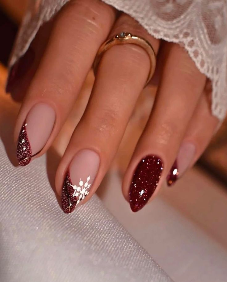 Burgundy glitter nails with snowflake accent
