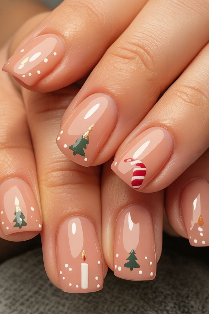Nude nails with mini Christmas tree and candy cane designs